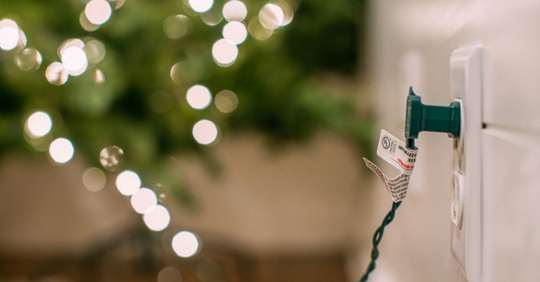 Christmas lights plugged into wall